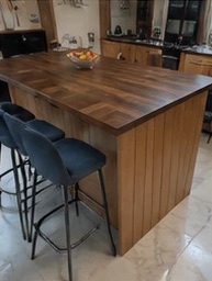 Walnut-topped kitchen island with breakfast bar seating